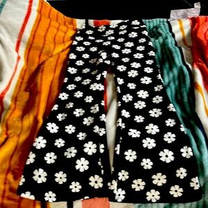 This is a fuzzy in side and has flower print an 10/12 in kids